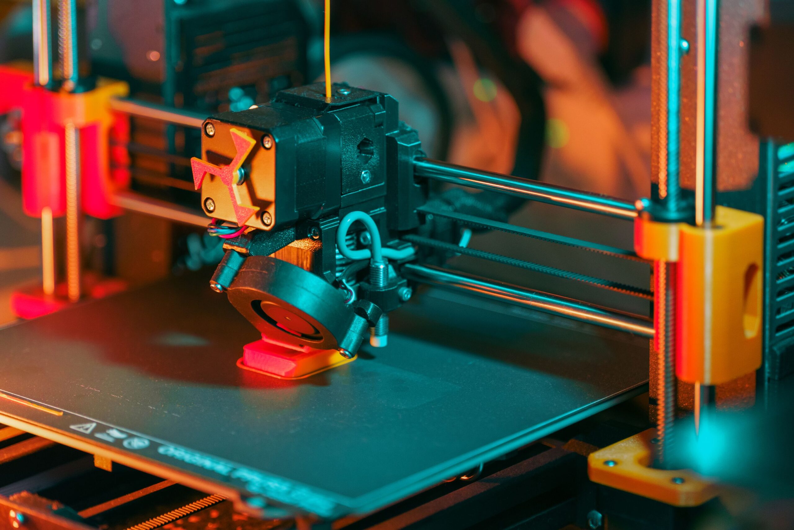 Home Detailed view of a 3D printer, highlighting the printing process and technological innovation.